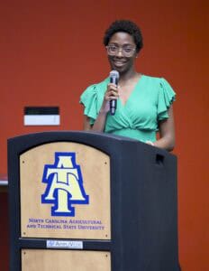 Empowered woman speaking at North Carolina Agricultural and Technical State University event.