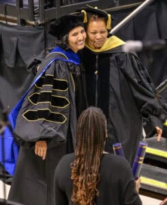 Empowering graduates during a graduation ceremony at CAES News. Celebrating academic achievement and.