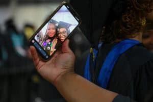 Graduation celebration with friends taking a selfie at the ceremony.