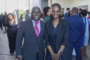 Celebrating professional networking at CAES News event with diverse business leaders.