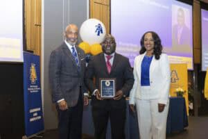 Celebrating academic achievement at CAES News event with distinguished professionals and award recip.